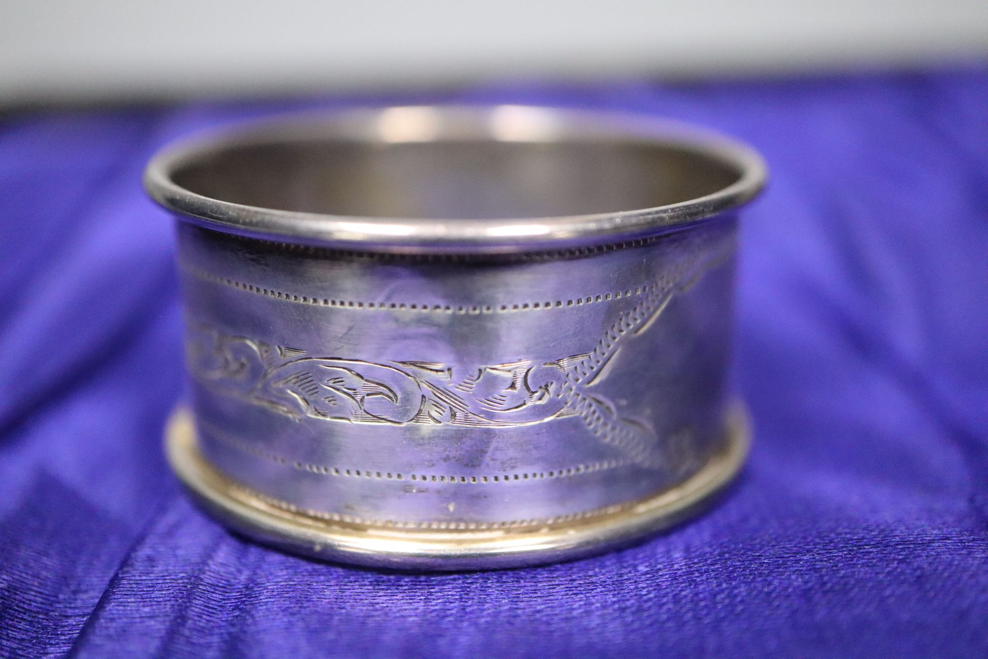 A set of six George V silver Old English and shell pattern teaspoons, other minor cutlery and three white metal napkin rings.